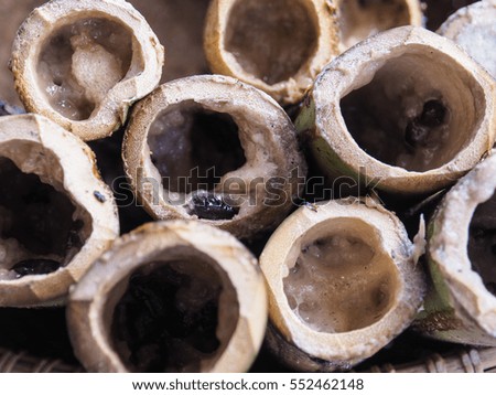 Glutinous rice roasted in bamboo joints have already finished. This is a part of cooking process of glutinous rice roasted in bamboo joints. Picture from Thailand country.