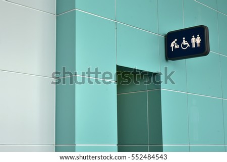 Public restroom signs with a disabled access symbol