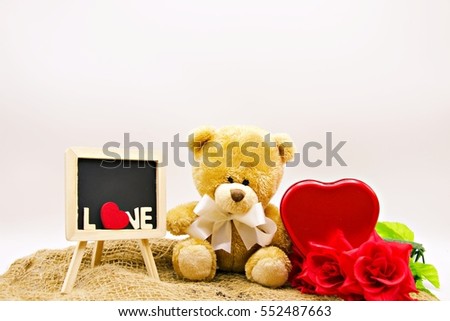 Bear with love lettering and red heart shape are on white background.