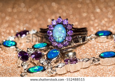 Fashion ring decorated with blue fire opal stones.