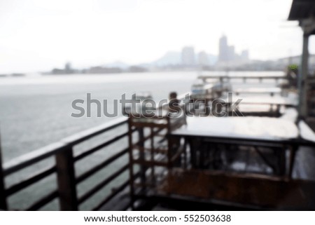 Picture blurred  for background abstract and can be illustration to article of table in restaurant near sea