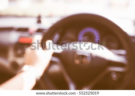 Picture blurred  for background abstract and can be illustration to article of hands driving car steering wheel