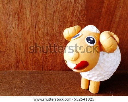 clay dolls children girl smiling and laughing on wooden background