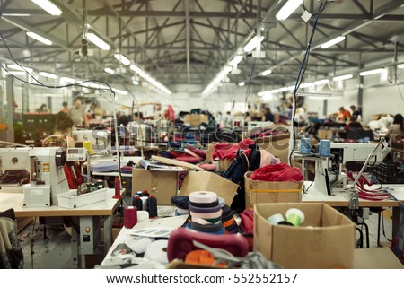 Industrial busy sewing workplace Royalty-Free Stock Photo #552552157