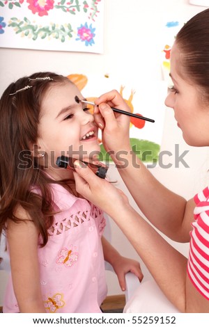 Child preschooler with face painting. Child care.
