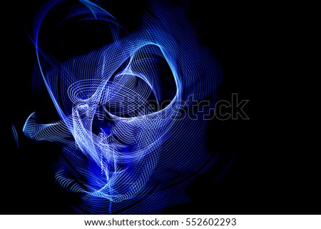 White to dark midnight blue abstract lines making spiraling net or networking cobweb des. Light painting fantasy galactic space photo image.