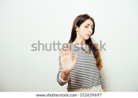 girl showing stop.  woman showing stop hand