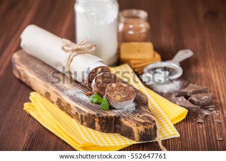 homemade chocolate sausage on a board, selective focus, copy space