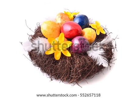 Easter eggs in nest. Festive holiday decoration. 