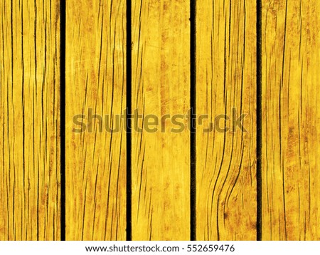 Bright yellow toned wooden background. Colored wood planks template. Rough timber natural pattern. Lumber board of table or floor. Rustic texture for vintage banner template. Modern shabby chic design