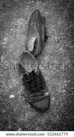 old men shoes on cement floor in lens vignetting