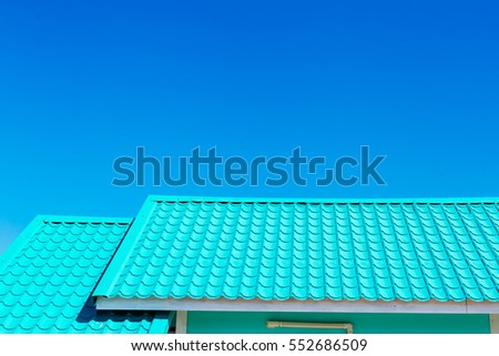Green roof with blue sky background