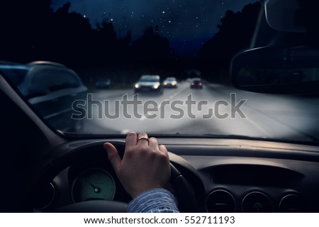 driving a car at night on the way Royalty-Free Stock Photo #552711193