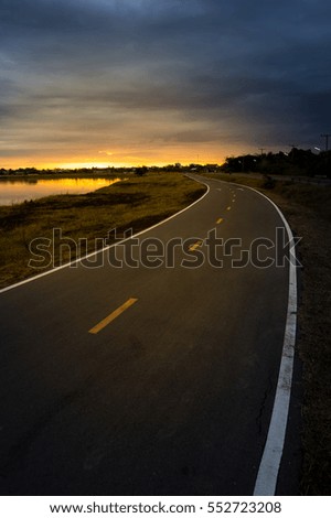 Bicycle lane with sunrise background.
