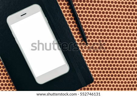 Smart phone and notebook, business office desk top view mock up copy space
