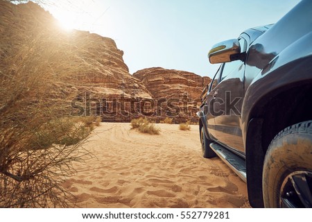Great big car on desert background  Royalty-Free Stock Photo #552779281