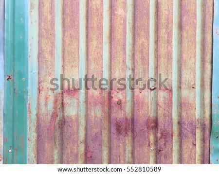 The rusty corrugated iron metal texture.