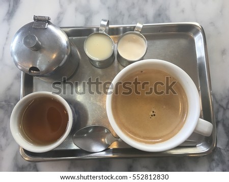 Ancient coffee set consisting of condensed milk and sugar cane.