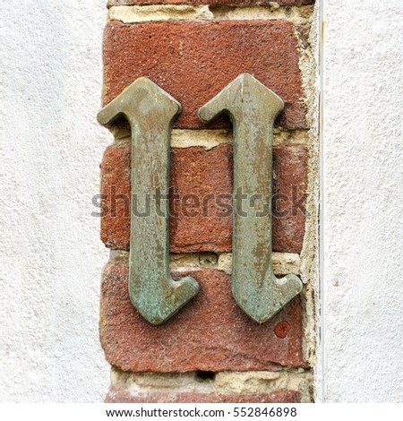 Bronze house number eleven (11)
