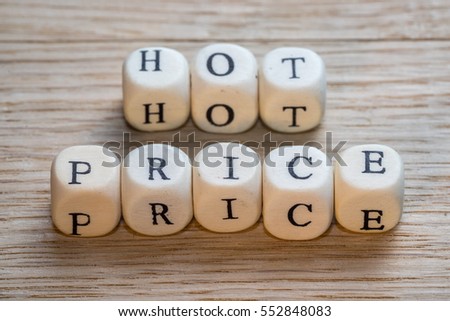 Hot price text on a wooden cubes on a wooden background, copy space