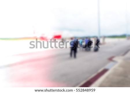 Picture blurred  for background abstract and can be illustration to article of people walking to plane in airport