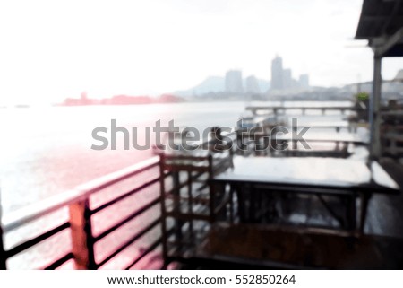 Picture blurred of table in restaurant near sea