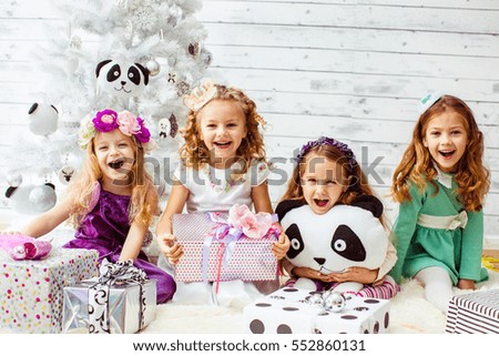 Beautiful and cheerful girls with the toys in the studio