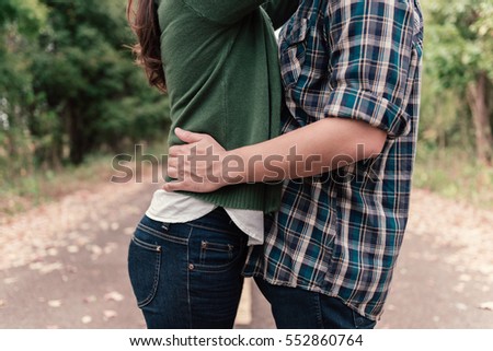 asian couple kissing outdoor on the street, vintage style.