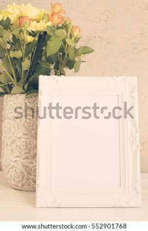 White Frame Mock Up, Digital MockUp, Display Mockup, Styled Stock Photography Mockup. Rustic vase with orange roses and yellow chrysanthemums. White background, empty place, copy space. Vintage tinted