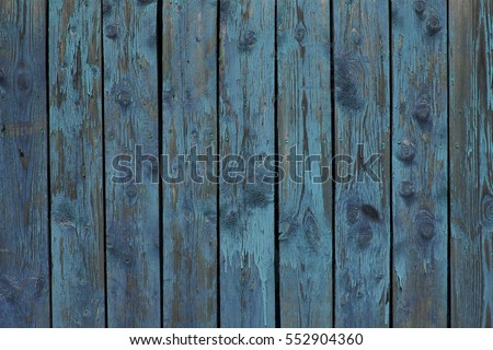 Wooden fence, old peeled-off paint. Vintage wooden grunge texture, photo wallpaper. background.