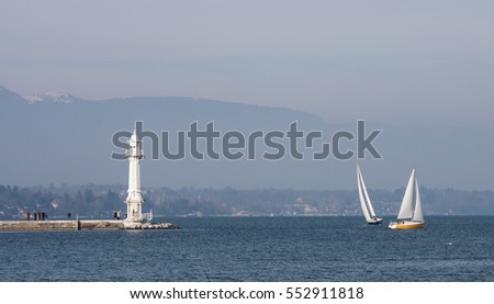 lighthouse on Lake Geneva against the backdrop of the mountains, swimming in the water sailing boats