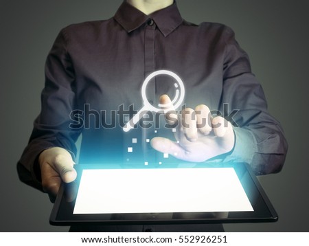 Image of a girl with tablet in her hands and search icon. Concept search engine optimization, customer support