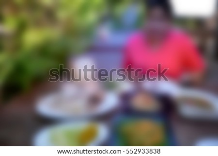 Blurred abstract background of woman eating restaurant