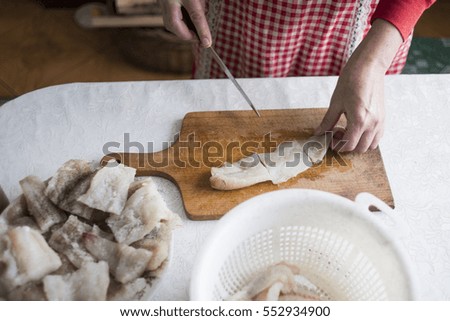 Process of cooking Fish preparation on a cutting board 