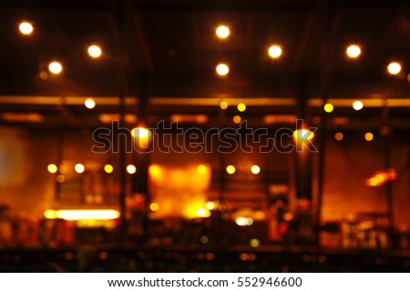 blur bar or pub at dark night background abstract  Royalty-Free Stock Photo #552946600