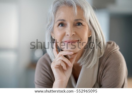 Portrait of beautiful senior woman with white hair Royalty-Free Stock Photo #552965095