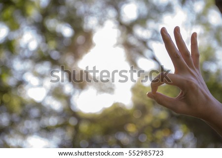 Outdoor hand gesture Royalty-Free Stock Photo #552985723