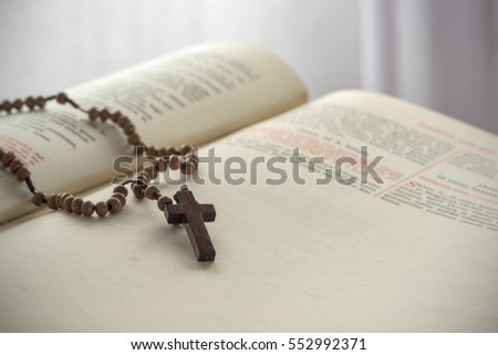 Catholic rosary beads and bible