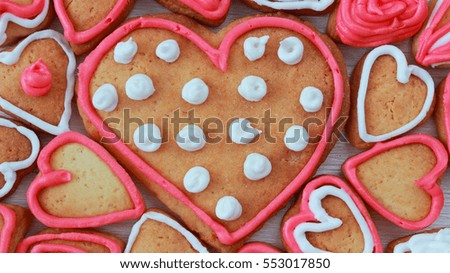 background with heart shape valentine homemade cookies on light wooden background