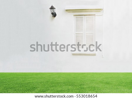 vintage window on clear white wall with electric lamp