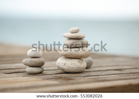 Zen Stones / Zen stone on beach for perfect meditation. Calm zen meditate background with rock pyramid on sand