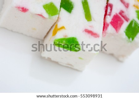 Paste with fruit pieces. delicacy. sweets. abstract background. Shallow depth of field, focus on a piece of fruit