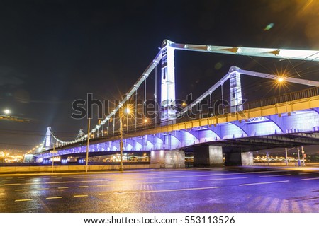 Krymsky Bridge at night, steel suspension bridge in Moscow, Russia. The bridge spans the Moskva River
