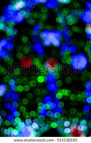 Blurry Christmas lights festive background.Christmas decoration background with lights glowing,happy new year Blurred background. Colourful of city night lights blurred bokeh texture.