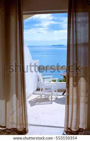 Hotel room with a sea view house near the sea in the environmental and green location on the island. The window overlooking the ocean. The endless expanse of the sea. Place for a romantic holiday.