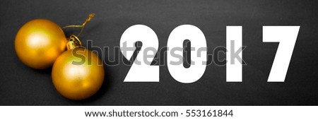 Text 2017 with two yellow balls on a black background