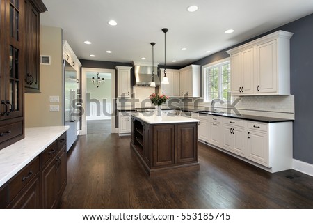 Kitchen in remodeled home with center island. Royalty-Free Stock Photo #553185745