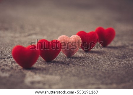 a large number of hearts on wooden background, close-up, Valentine's day