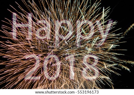 Happy New Year 2018 with colorful sparklers. The words Happy 2018 are integrated into the fireworks on black background