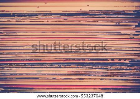 Spines of Vinyl record album covers in stack with vintage tone  